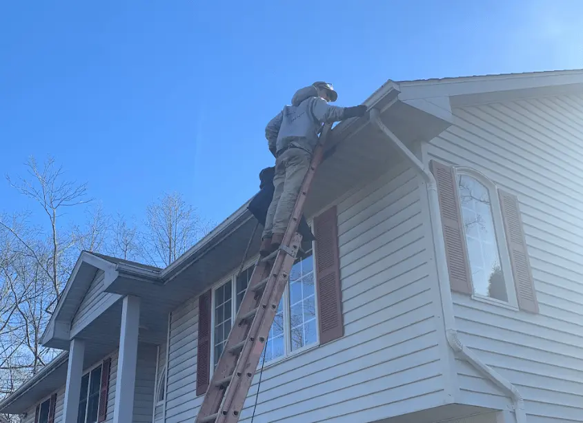 Gutter cleaning and maintenance being performed by Fairview Park Power Washing in Fairview Park